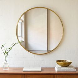 WEST ELM Metal Frame Round Wall Mirror Social Share Icon $499 Antique Brass  Framed 48" Mirror: 48"diam. x 1.5"d; 53 lbs.  The round, minimalist desig