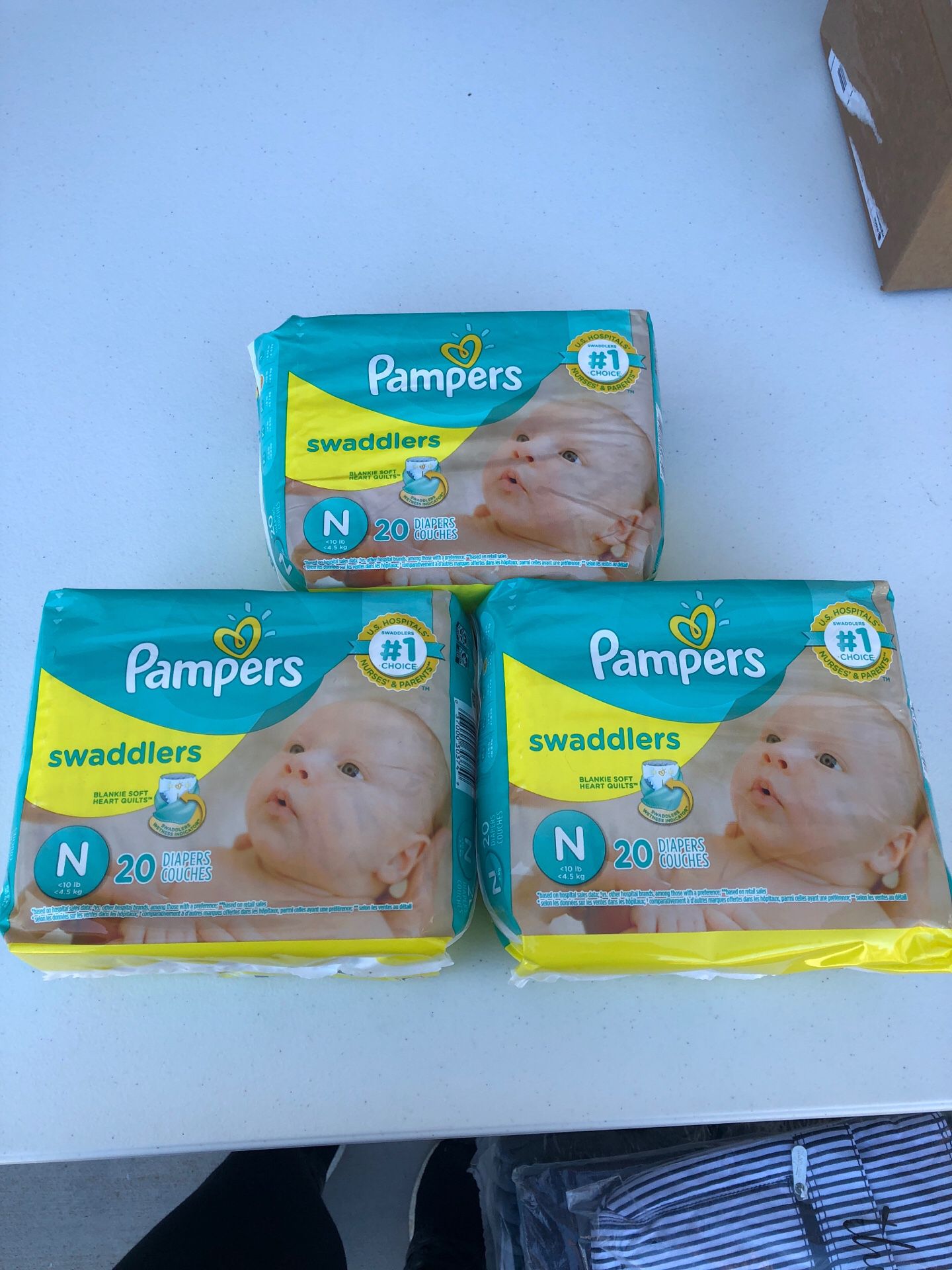 Pampers size newborn. Brand new $5 each bag. 20 diapers in each bag. Pickup Riggs and McQueen.