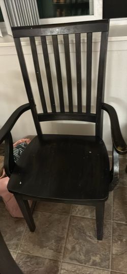 6 black wooden chairs