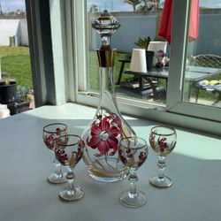 Antique alcohol decanter with four glasses. Perfect condition. No chips no cracks very beautiful.