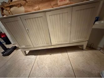 Wooden cabinet with marble top