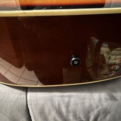 Mitchell 6 string acoustic guitar.