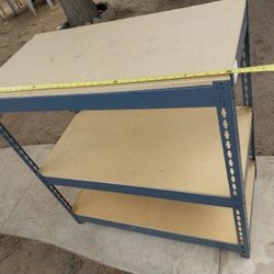 STORAGE RACK 36" W x 36"  H X 18" D -- A COUPLE SHELVES ARE CHIPPED FROM A CORNER BUT DOES NOT AFFECT IT  CAUSE IT SEATS FLAT ALL THE WAY AROUND