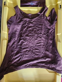 Purple sleeveless top, medium size.