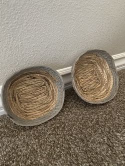 2 Woven baskets made from natural fibers like seagrass, water hyacinth, or bamboo