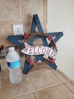 Wooden star with metal stars
