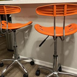 orange counter/ desk chairs 