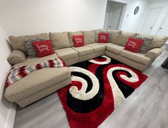 Ashley Furniture "Baceno” 4-Piece Modular Sectional With Chaise. (DELIVERY AVAILABLE).