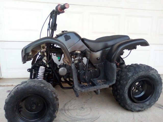 .ATV 125CC gas fully automatic  has electric start & reverse starts right up it runs cash only no trades $466  Bill of sale 