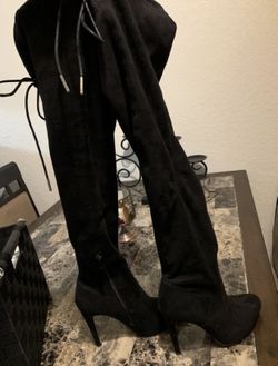 Thigh high black boots
