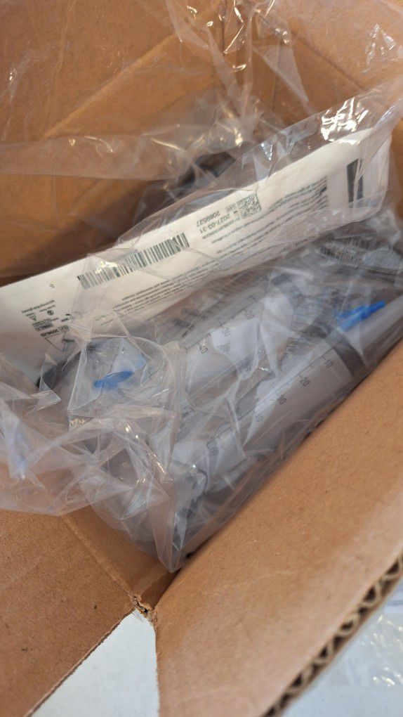 Feeding Tube Syringes And Container Of Thickit 