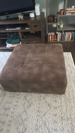 Brown leather ottoman