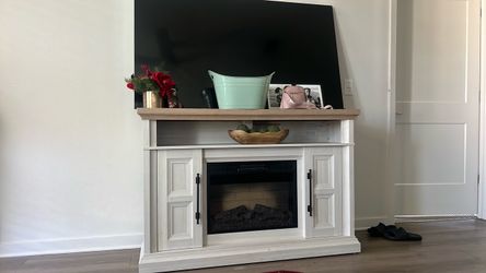 Entertainment stand with fire place