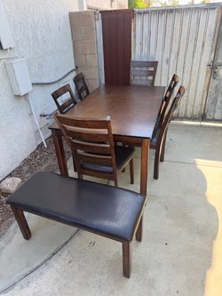 8-Piece Dining Set — Table + 6 Chairs + Padded Bench