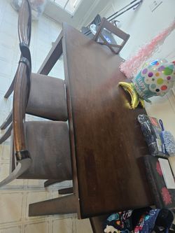 Brown table and 4 chairs