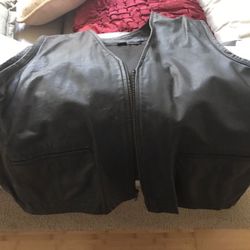 Leather vest XL with Harley emblem on back.