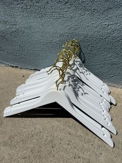 White wooden Hangers With Gold Tips