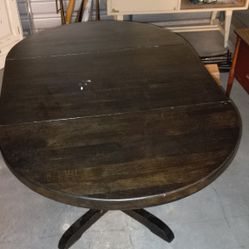 Solid Wood Table With Fold Down Leaves.