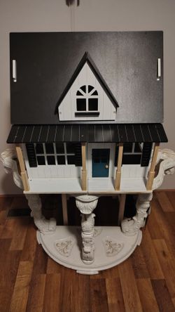Farmhouse style wooden dollhouse