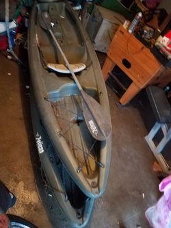 Two Pelican fishing kayaks with gear