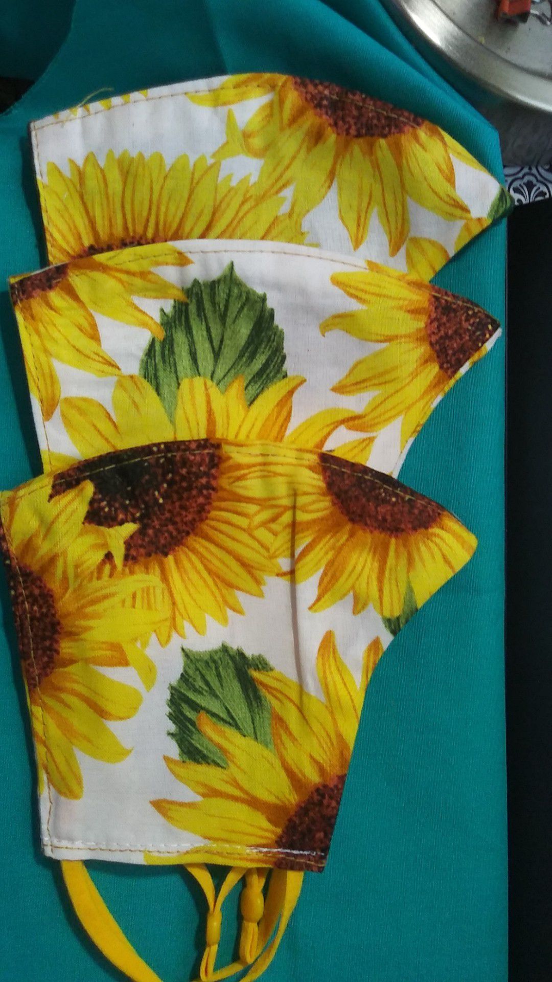Bright sunflower print face masks with NEW adjustable elastic for ease on the ears.