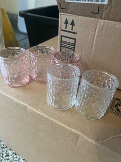 Glass Votive candle holders with batter candles.
