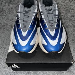 Size 9.5, men’s brand new unworn Adidas shoes with tags and box