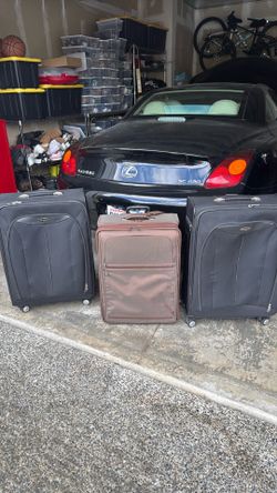 2 Samsonite and 1 Tumi luggages