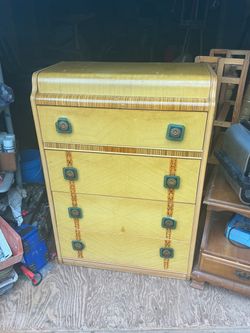 Vintage Art Deco Waterfall Blonde Tallboy Dresser it’s 46 inches tall 32 wide and 16 inches deep