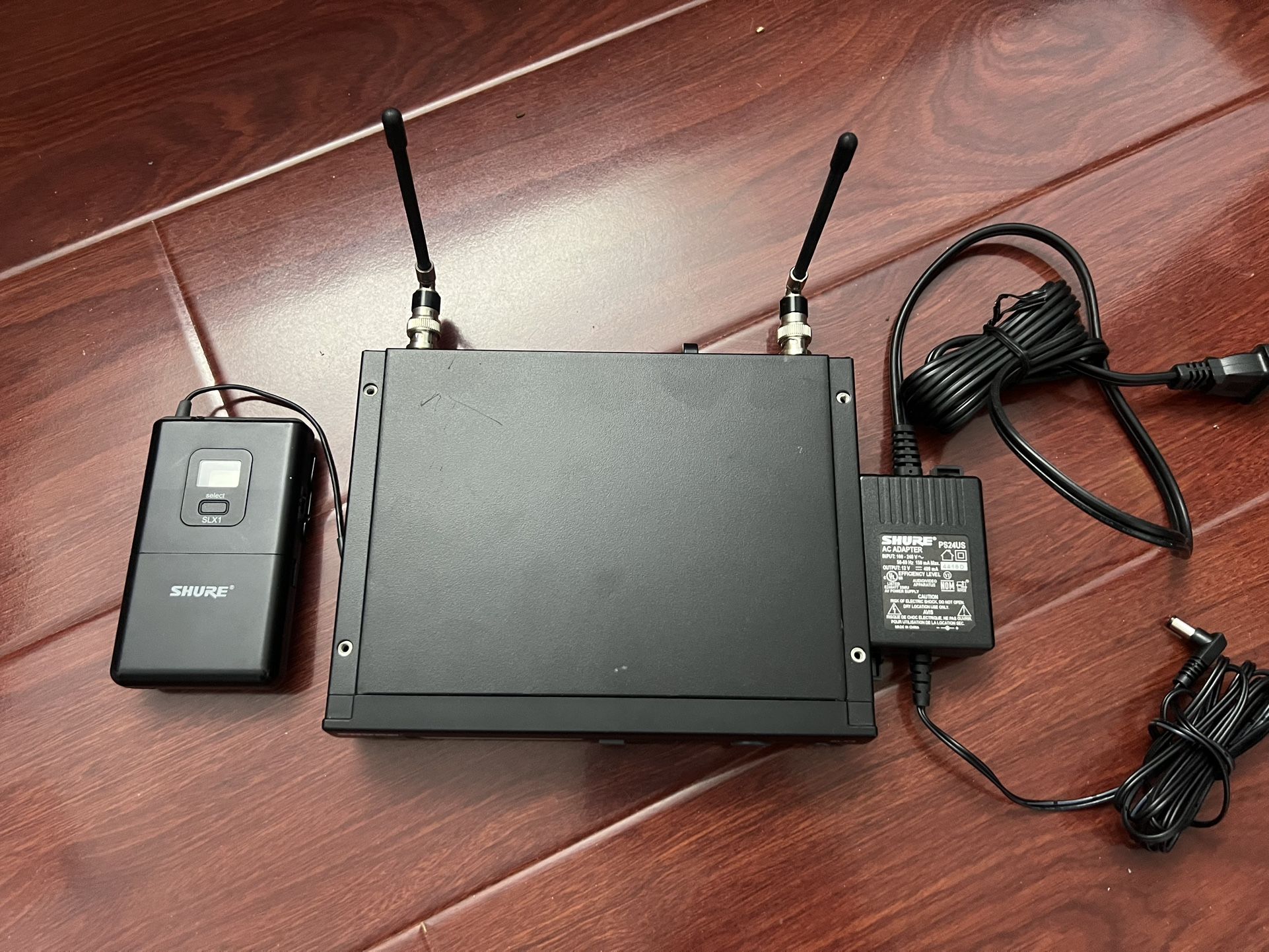 Shure SLX4 G4 Band Wireless Receiver, Lavalier Belt Clip Mic, Antennas and AC power Adapter.