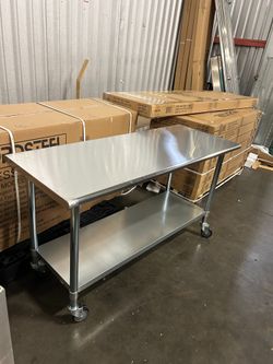 New rolling stainless steel work tables NSF Nordsteel brand 4 feet x 24" 