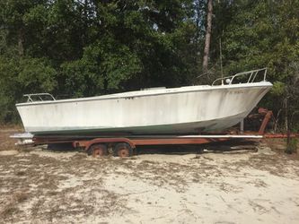 28' open Hull boat with double axle easy tilt trailer