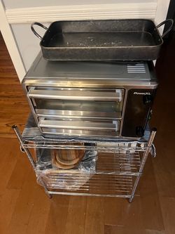 Air fryer with stand and items underneath