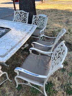 FREE 8-Piece Patio Set: 63" Stone Mosaic Table, 6 Metal Chairs & Umbrella Base