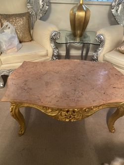 pink marble table with gold wood 
