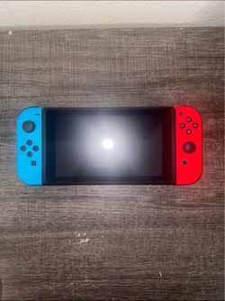 Nintendo Switch with PRO controller and Smash Ultimate in SD card