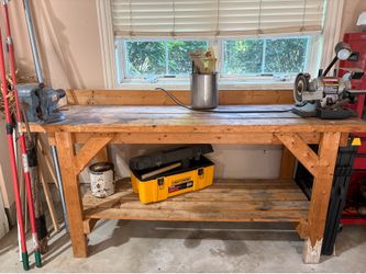 Wood work bench with vice and grinder attached