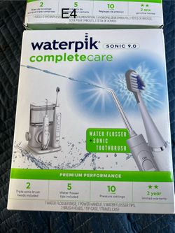 Waterpik toothbrush Complete Care 9.0 set includes a water flosser base and a sonic power handle