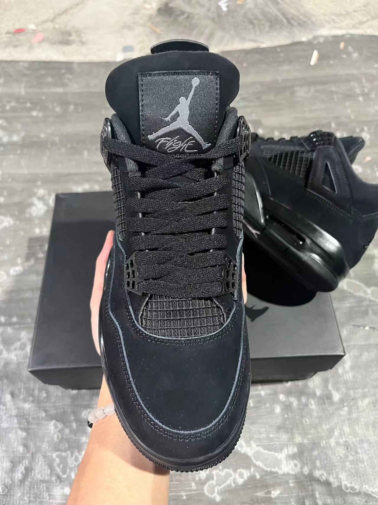 black cat jordan 4s