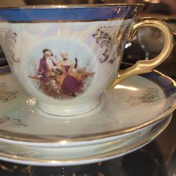 vintage porcelain demitasse cup and saucer set"Victorian Couple"