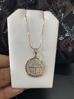 Atocha silver coin pendant in gold bezel with silver chain