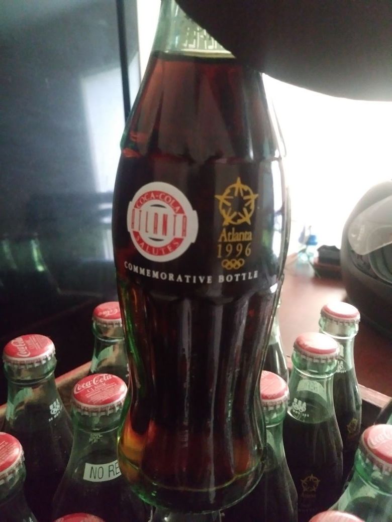 1996 Olympic Coca-Cola bottles and coca cola create dated in 1977.