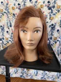 Mannequin head is the Pivot Point Irene 100% Human Hair
