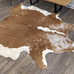 vintage authentic cow hide rug approx 6'*6'  normal wear & tear appropriate to it's age