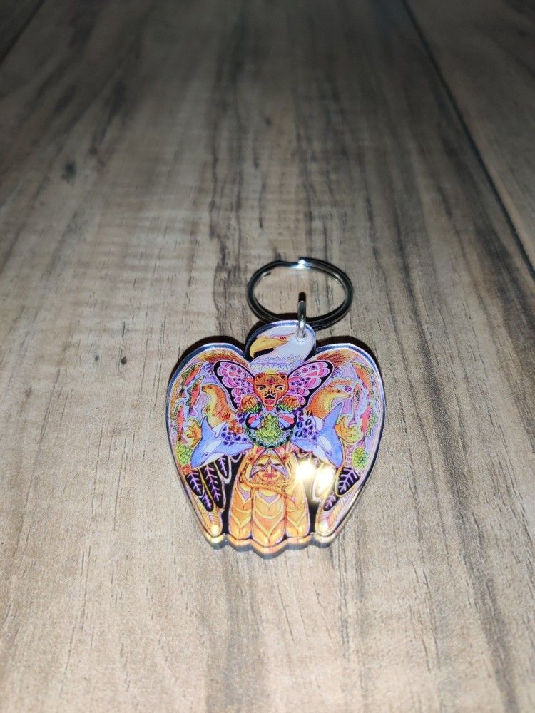 Sue Coccia Earth International Eagle Graphic Keychain. Has some wear from age and use. Sold as is.