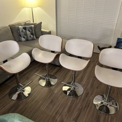4 Adjustable Bar Stools - $50 Each