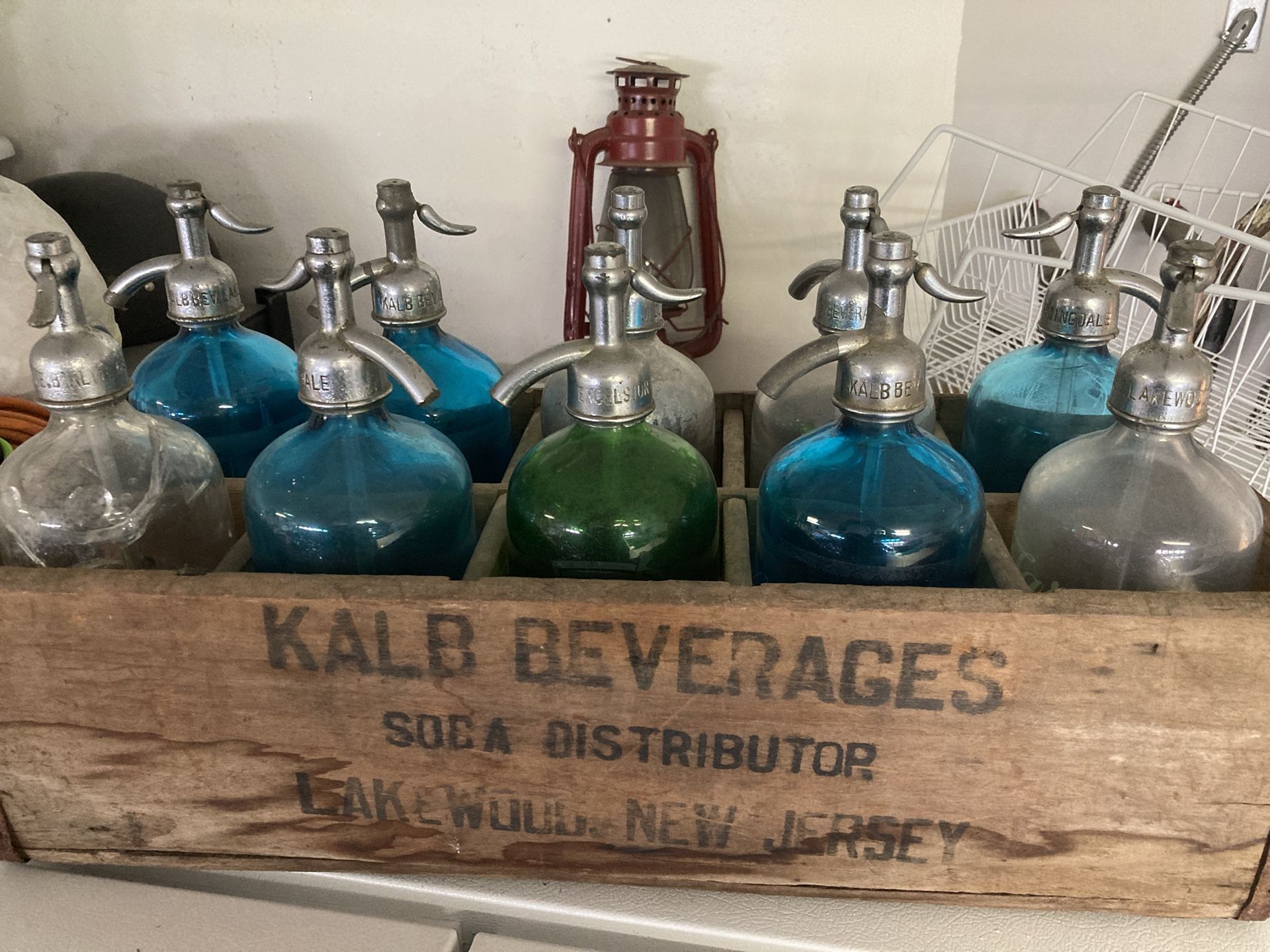 Antique Seltzer Bottles In Crate