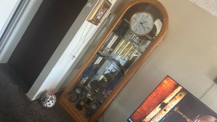 Howard Miller grandfather clock works great moving