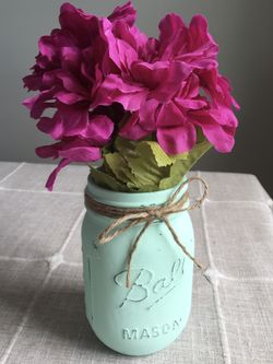 Distressed mason jar vase with silk flowers