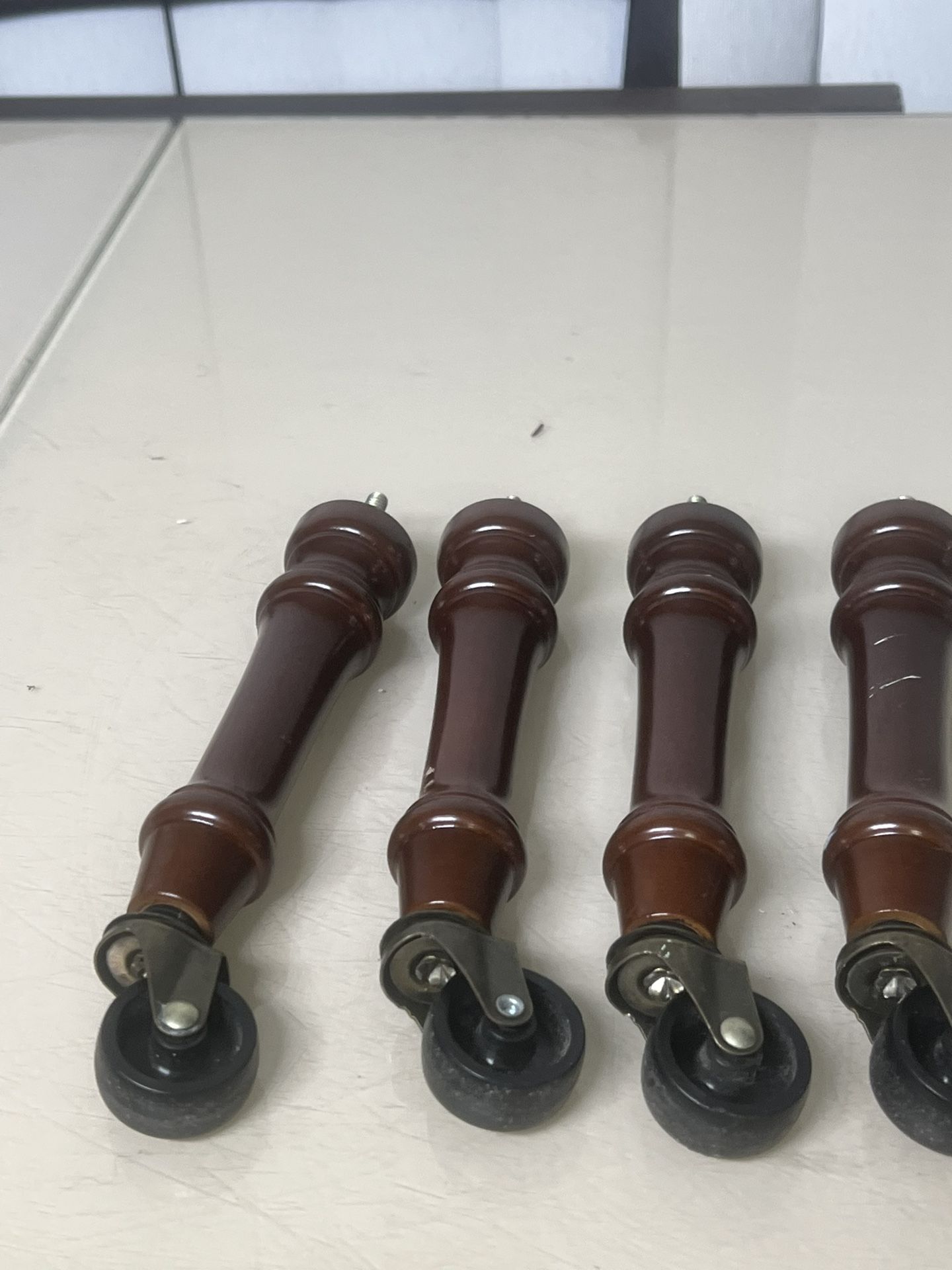 Solid Wood Screw On Ottoman/Chair Legs With Wheels 7 Inch Replacement Rollers. There are a few scratches and scuff marks on a couple but overall in go